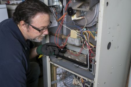 A man working on an HVAC repair in Gaffney, SC